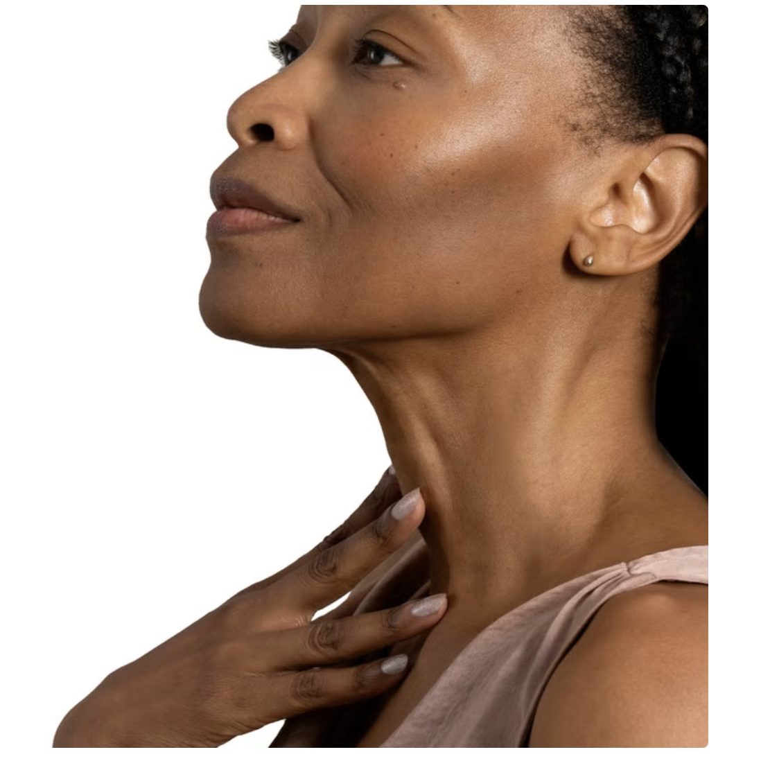 Woman applying StriVectin neck cream