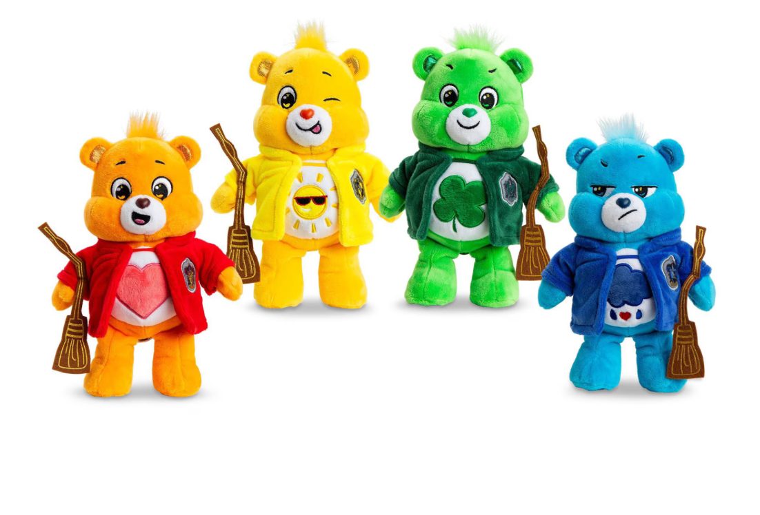 4 Harry Potter x Care Bears plush in red, yellow, green and blue robes holding brooms