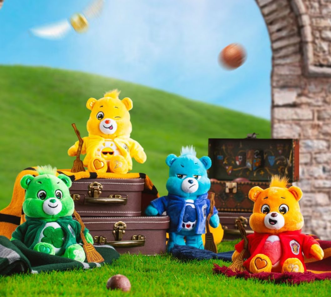 Harry Potter x Care Bears plush bears with brooms sitting on suitcases outdoors