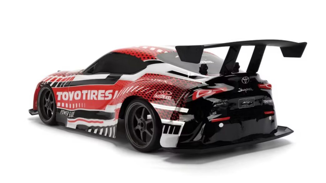 Rear three-quarter view of Jada Pink Slips Toyota GR Supra RC car with large rear wing