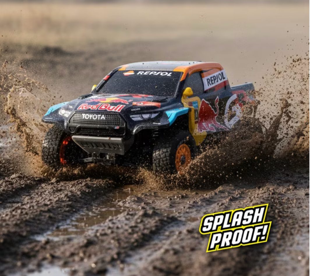 Nikko Toyota Gazoo Racing Dakar RC truck driving through mud, splash proof